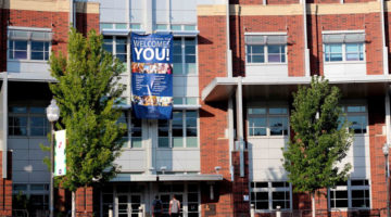 the Joe Crowley student union stands with a banner reading "UNR welcomes you"