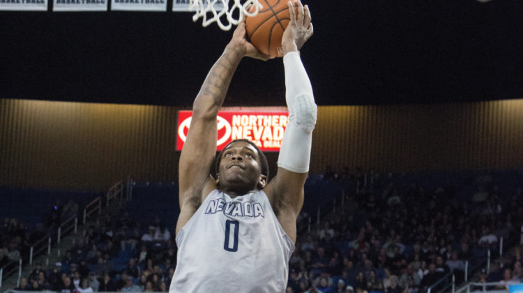 Cam Oliver goes up for a dunk.