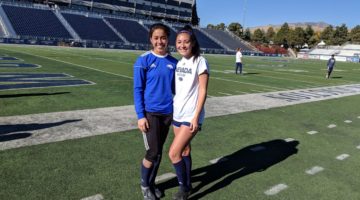 Soccer players Kendal Stovall and Kylie Minamishin pose for a photo together during practice.
