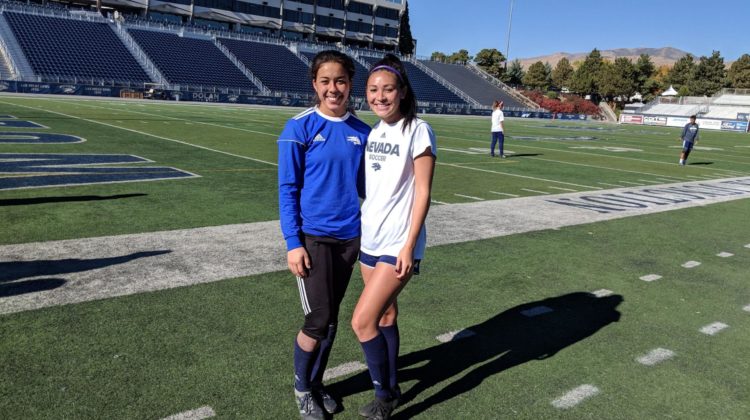 Soccer players Kendal Stovall and Kylie Minamishin pose for a photo together during practice.