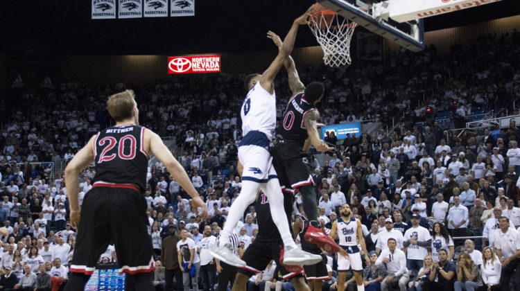 Tre'Shawn Thurman dunks in a game against Fresno State.