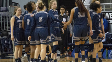 Nevada Women's Basketball huddles after a loss.