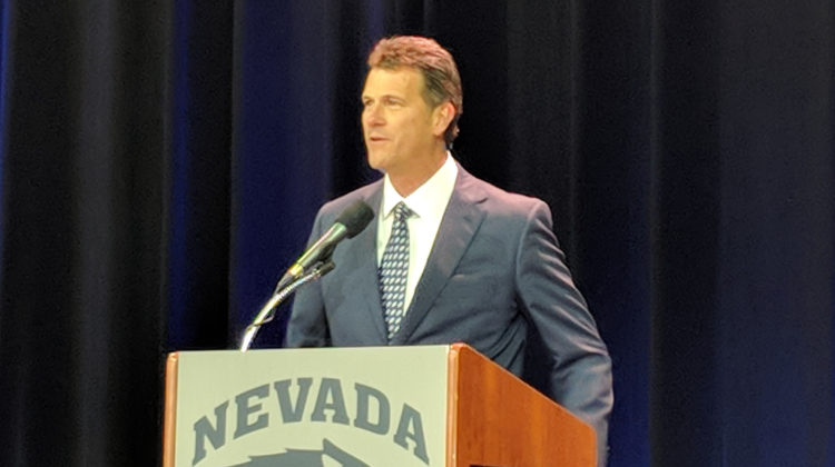 Steve Alford stands at the podium during his introductory press conference