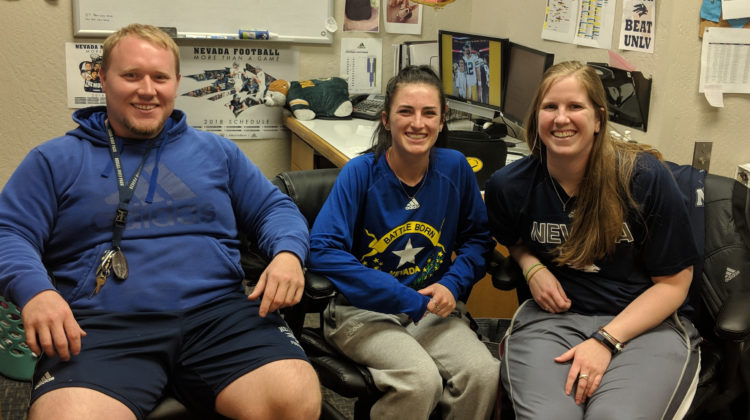 Kaleb Daws, Shannon O'Hair and Kristi Wirtz pose for a picture in their offic