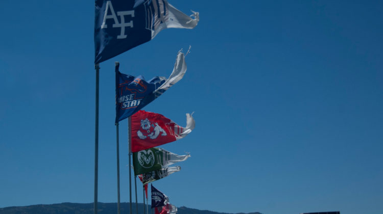 Flags representing the various Mountain West Conference universities fly above the stands at Mackay Stadium in Reno, Nev. The flags include the logos of Air Force, Boise State, Fresno State, Colorado State, Hawai'i, Nevada, New Mexico and San Jose State can be seen. The MW Mountain West Conference logo is seen right next to each of the school logos.