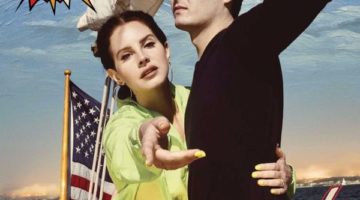 A woman and a man are on a ship. The brunette woman is wearing a green shirt and is reaching her hand out. The man has brown hair, is wearing khakis and a long-sleeved black shirt. There is an American flag in the background with the words "Norman Fucking Rockwell!"