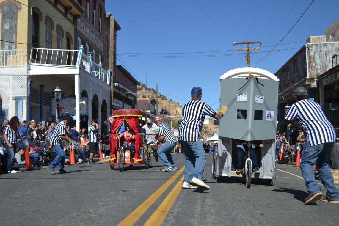 Two outhouses race down C Street in Virginia City, Nev. The event is held annually in the historic Nevada city.