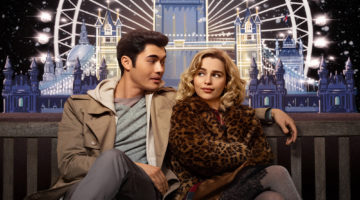 Movie poster for "Last Christmas." Emilia Clarke and Henry Golding are sitting on a bench in front of the London Eye.