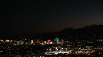 Night picture of the landscape of downtown Reno. There are lit up buildings.