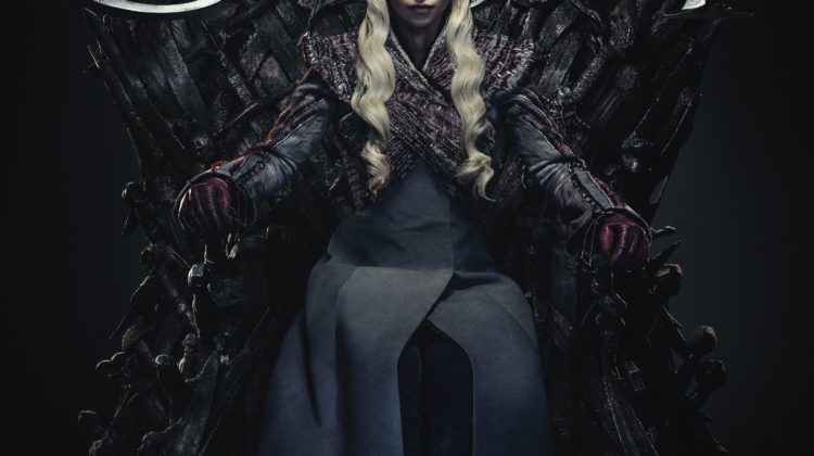 Daenerys Targaryen, wearing a long robe, sits on a throne. The initials "GOT" are spread across the top half of the page.
