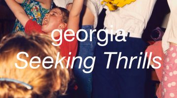 Album cover for Georgia's "Seeking Thrills." The cover shows a bunch of kids with their arms raised.