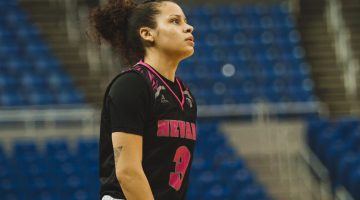 Essence Booker walks the court during a game at Lawlor on Jan. 29. Booker is wearing an all-black uniform with pink accents.