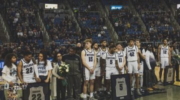 Multiple Nevada seniors are pictured during a post-game celebration for the graduating seniors on Feb. 29. All are wearing an all white Nevada basketball uniform.