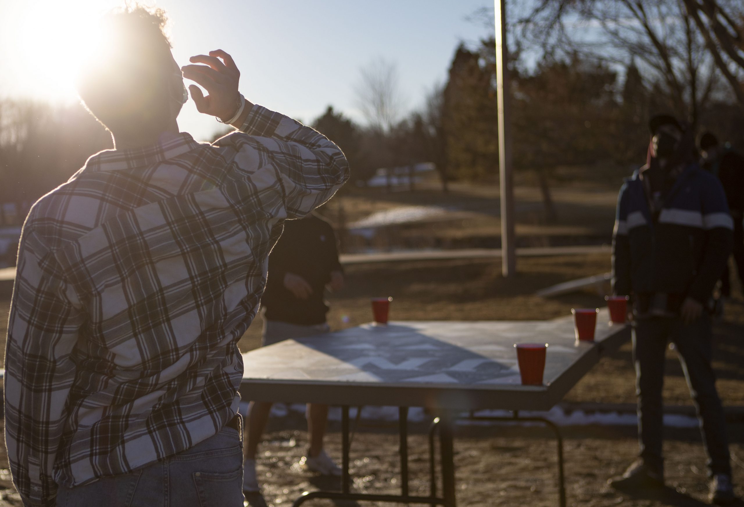 An attendee at an Alpha Sigma Phi spring rush event plays water die.