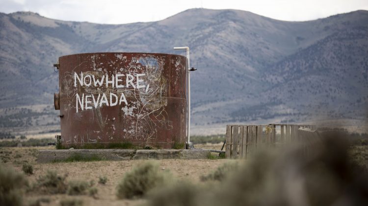 Rustic tank with the words "Nowhere Nevada" painted on.