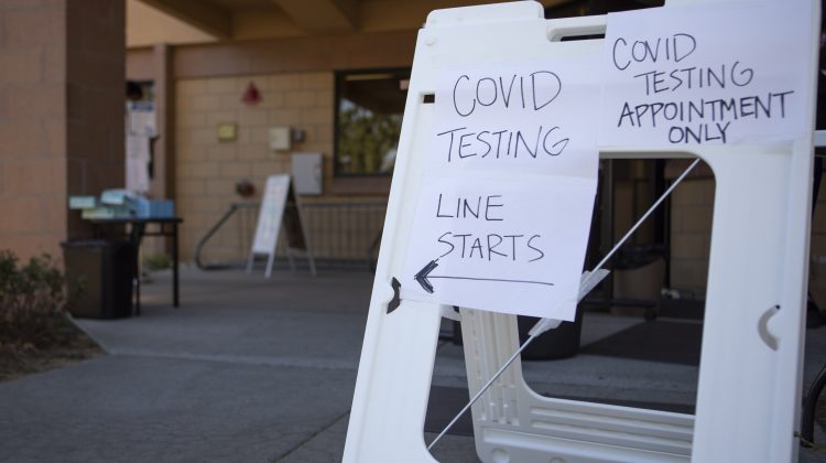 Sign that reads COVID testing line starts, appointment only