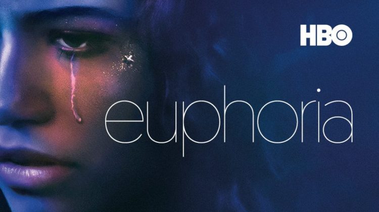 The main character Rue, looks off blank-faced into the distance (though only half her face is showing) with a glittered line resembling a tear running down her face, her hair covered by a blue lighted background and the title "Euphoria" in lower-cased letters with the TV organization "HBO" in white font in the top right corner.